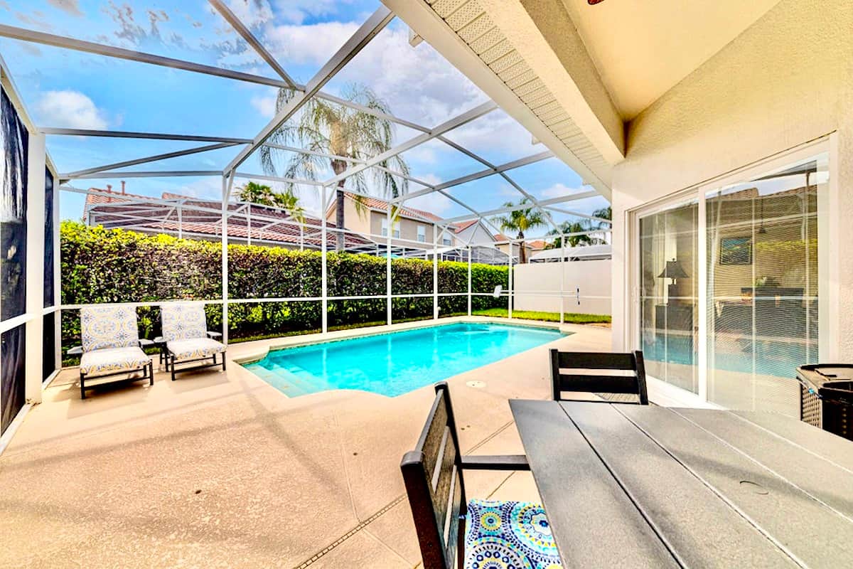 Access to the pool area is off the sitting room space