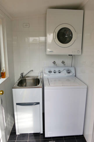 Fully equipped laundry with industrial family size washer