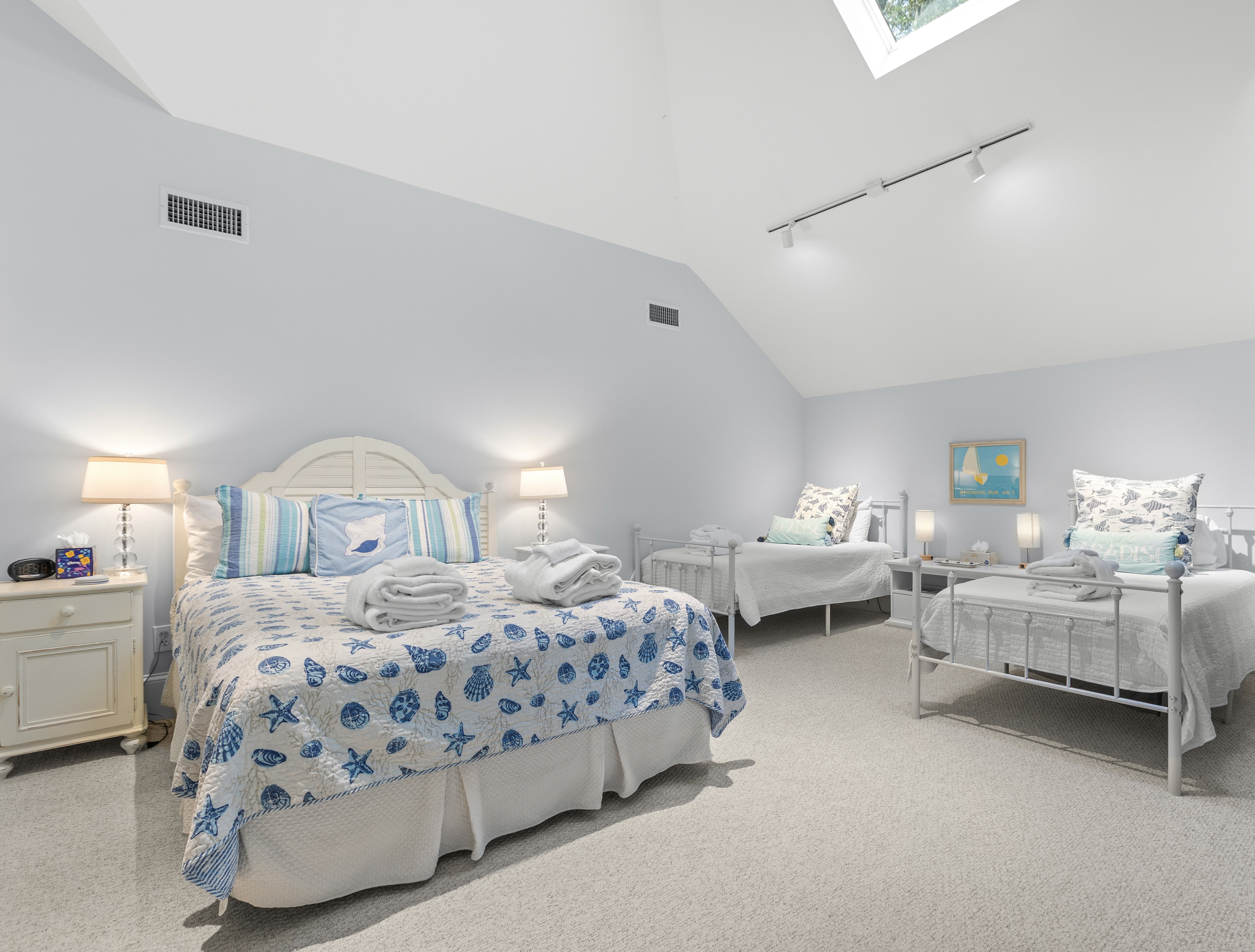 Queen bed and two twins, sleeps four, with an en-suite bath