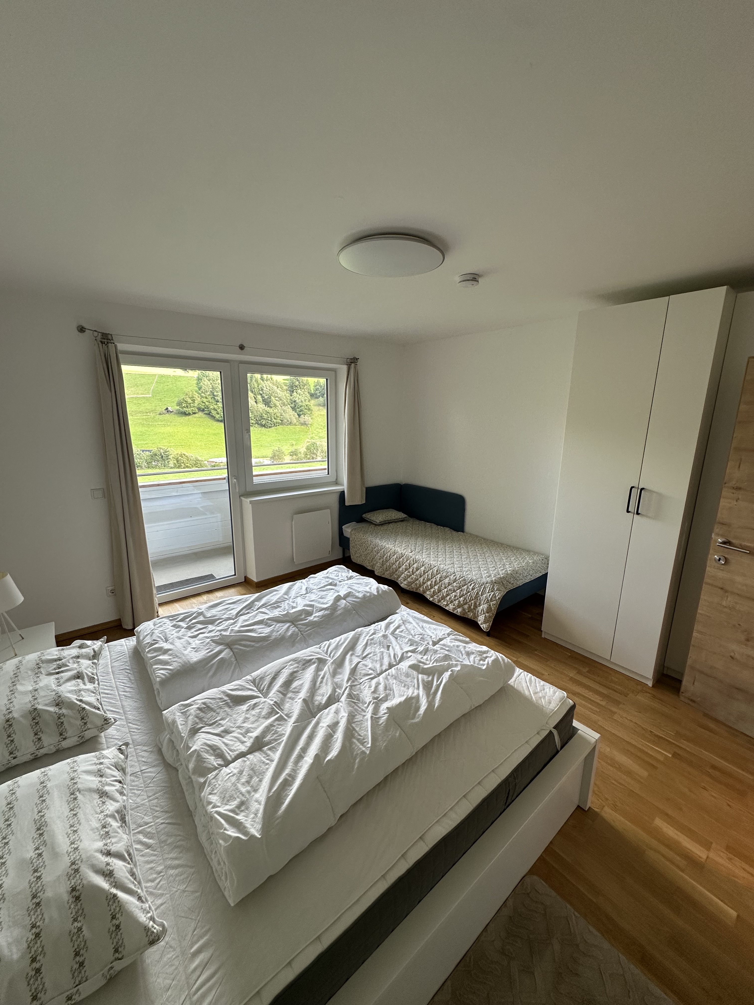 Bedroom with a double bed and a single bed