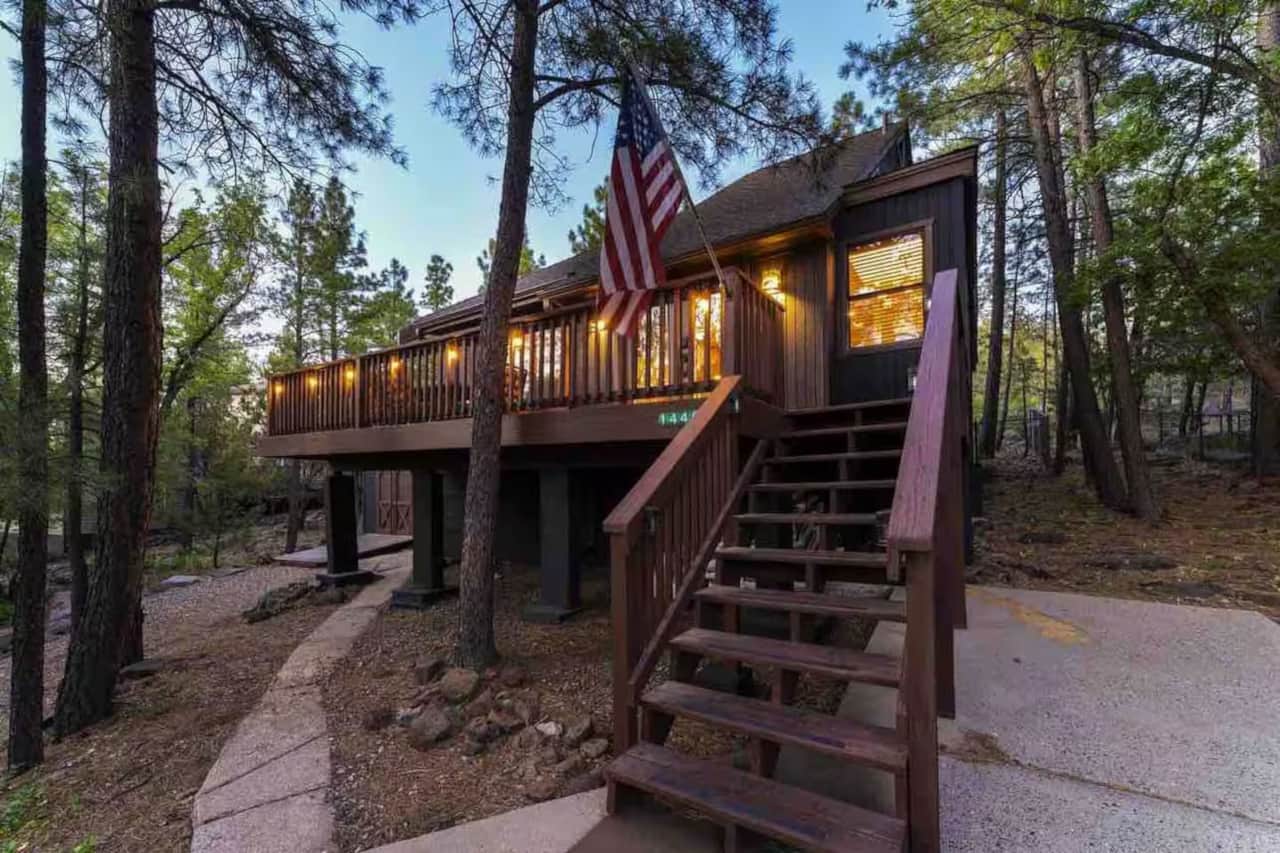 Front deck of mountain cabin at dusk in Munds Park