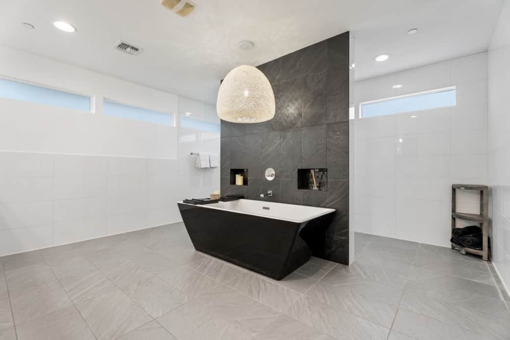 Soak in the primary tub and let your stress melt away in the oversized spa-like primary bathroom.