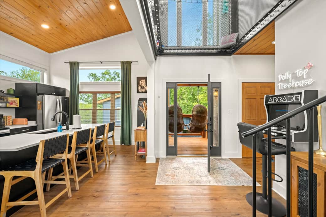 Open and inviting floor plan with another deck to enjoy at the back of the treehouse Open and inviting floor plan with another deck to enjoy at the back of the treehouse