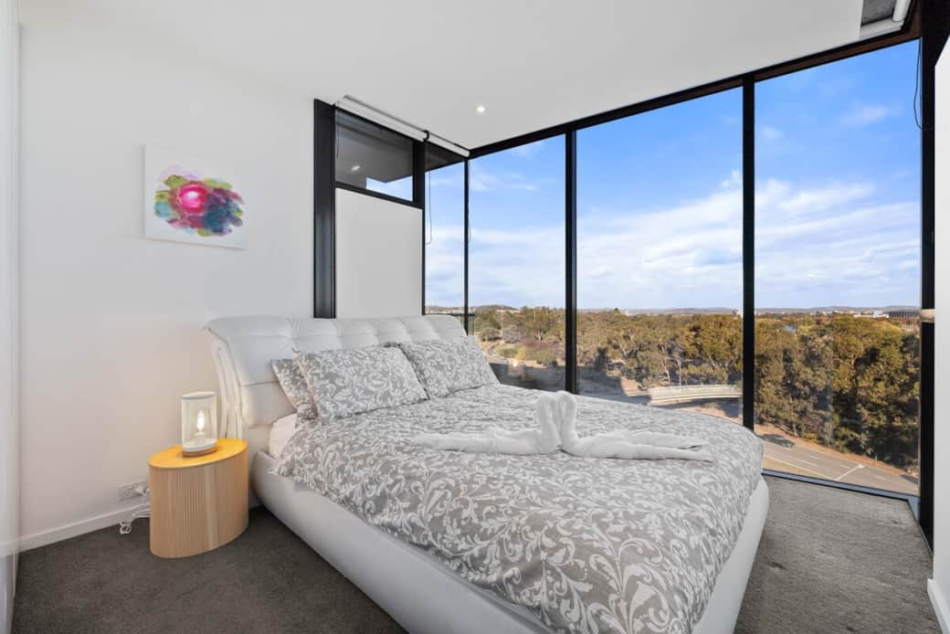 With a cozy bed and ample natural light from the large windows, it's perfect for restful nights. The room's decoration is simple yet elegant, creating a calming atmosphere. Enjoy the view of the natural surroundings, making every stay memorable.