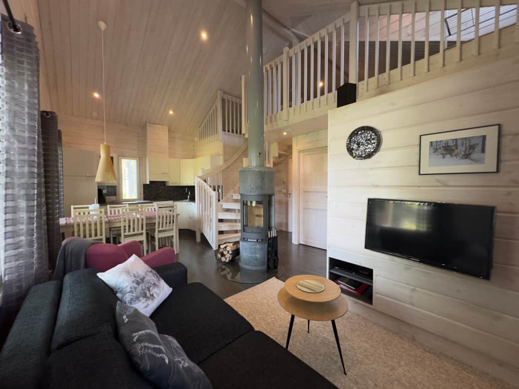 Modern cabin with a fireplace, kitchen, sauna, bedroom and two beds upstairs. Modern cabin with a fireplace, kitchen, sauna, bedroom and two beds upstairs.
