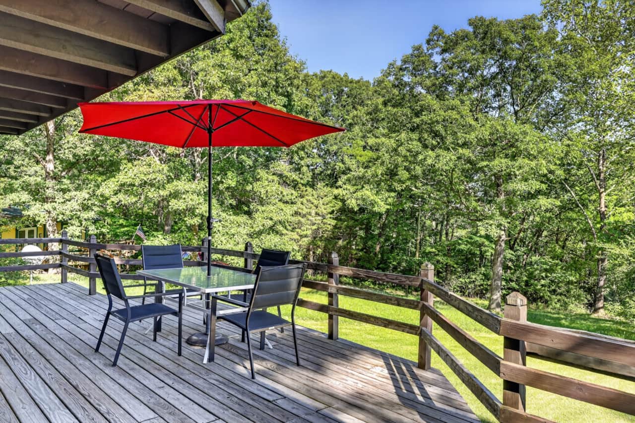 Relax and reconnect on Forest Glen’s spacious deck surrounded by peaceful woods