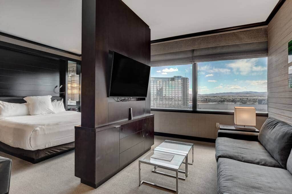 Open-Concept Suite with Bed, TV and Strip Views
