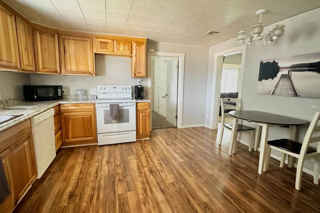 The kitchen and dining area of the 4 bedroom home