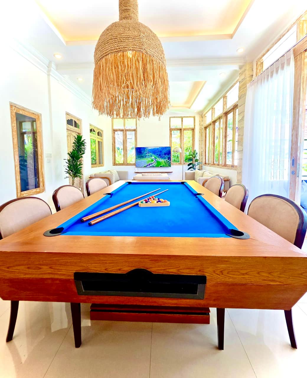 Dining area with handcrafted designer billiard table, perfect for family games and meals in Seminyak