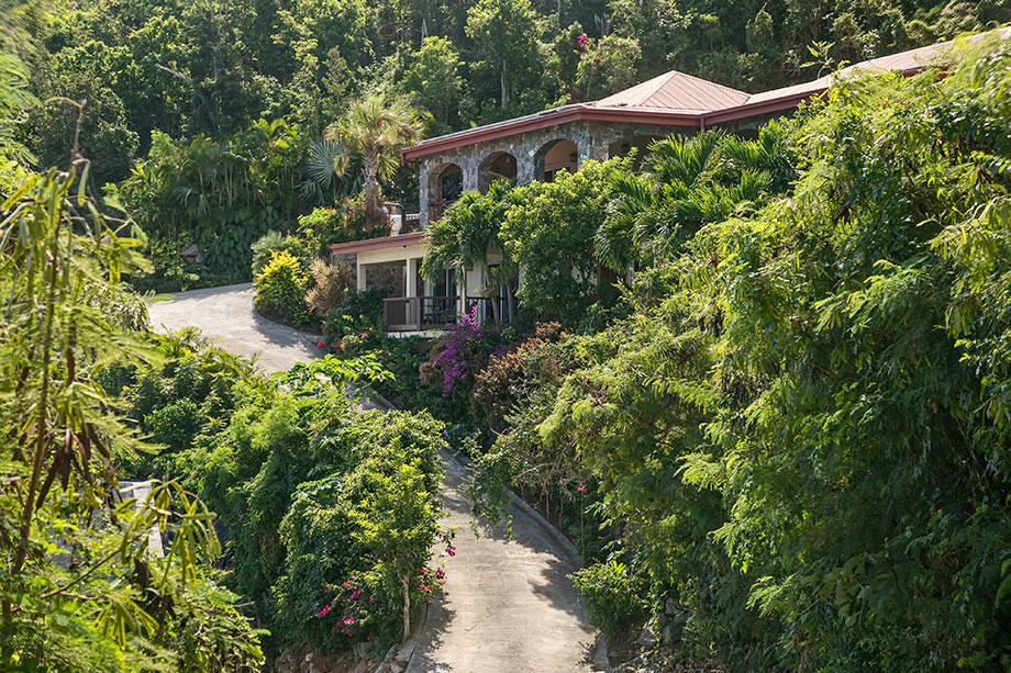 Lush tropical gardens surrounding Easy Breezes ensuring privacy