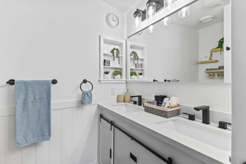 Ensuite master bathroom with a double sink vanity