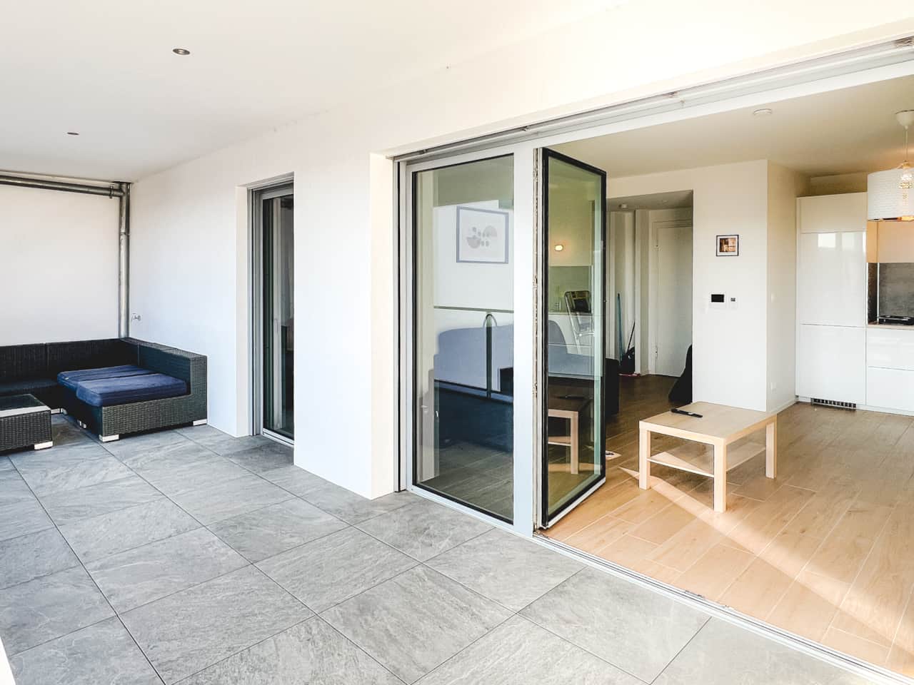 Living room opening onto a large balcony