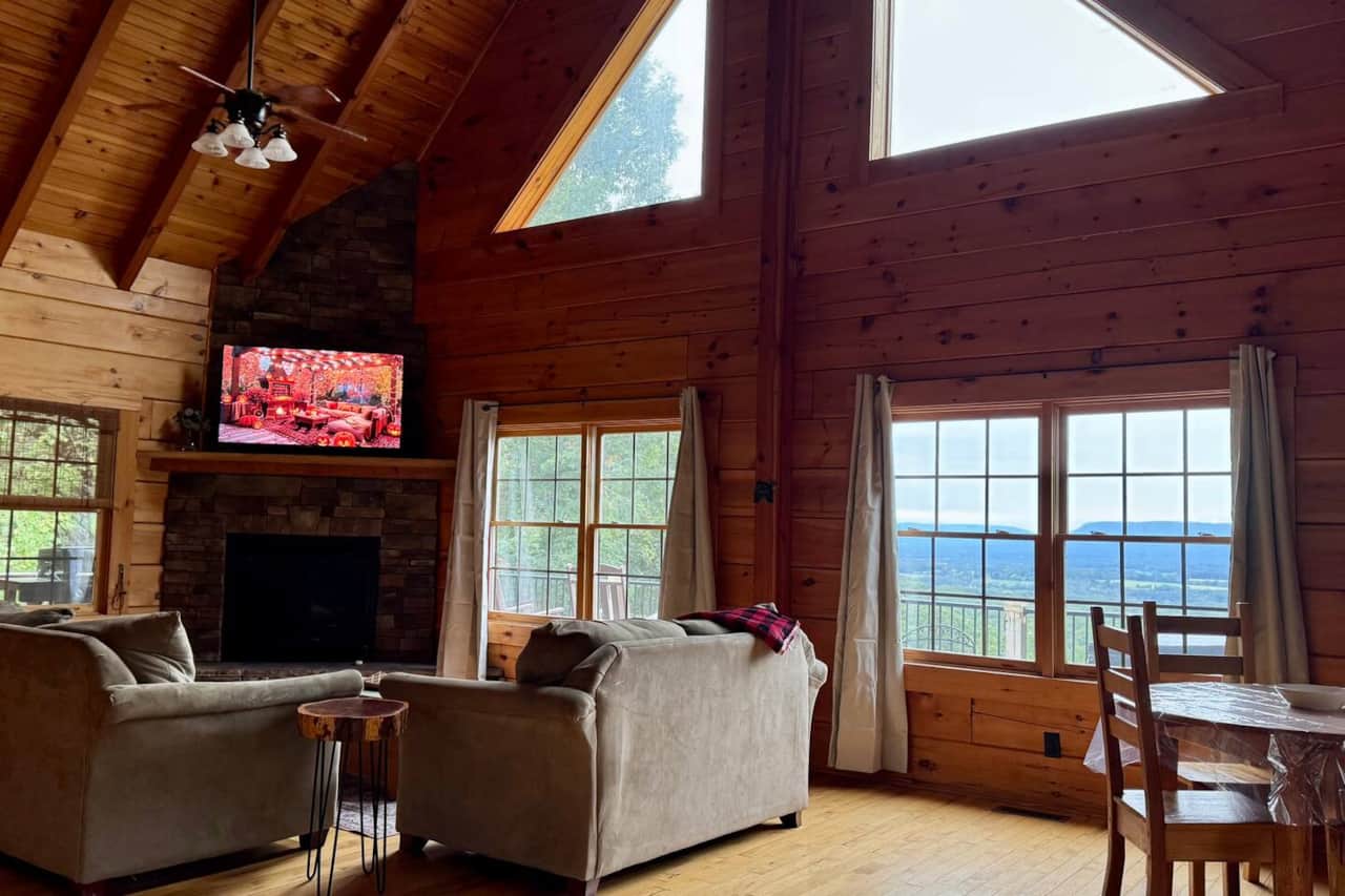Spacious living room with gas logs fireplace and a stunning view