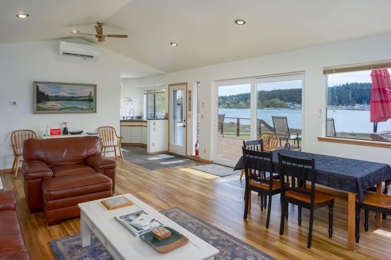 The living room opens onto the deck and views of the bay.