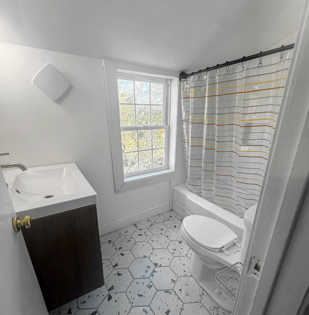 Upstairs bathroom with bathtub