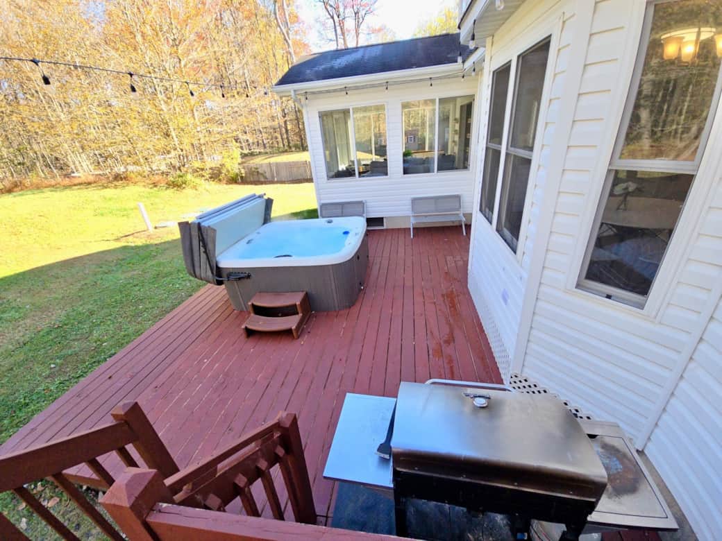 Back deck with hot tub and grill