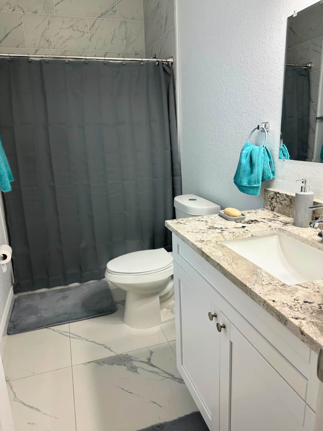Bathroom – Fresh, modern bathroom with essentials provided.