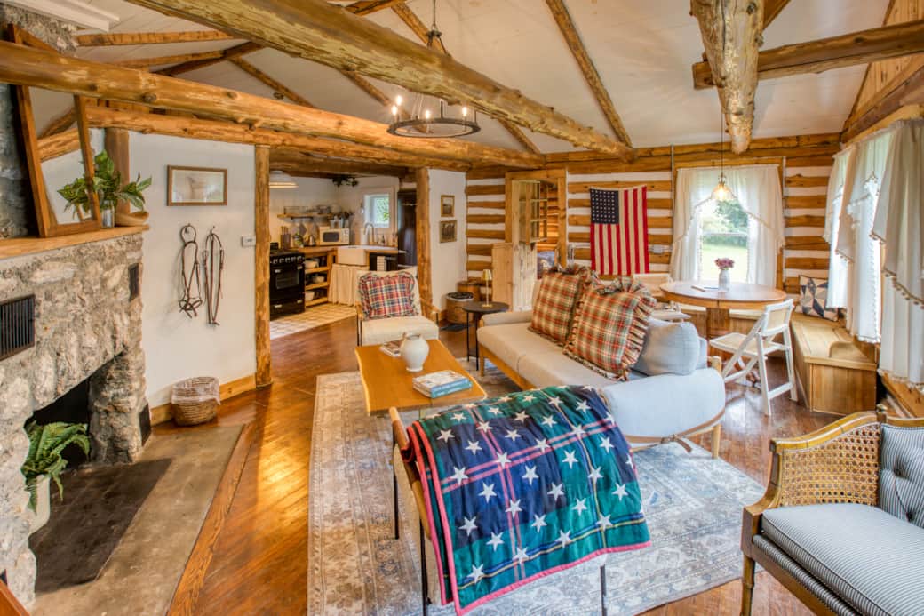 Relax in our cozy living room, decorated with rustic Americana charm and a warm stone fireplace.