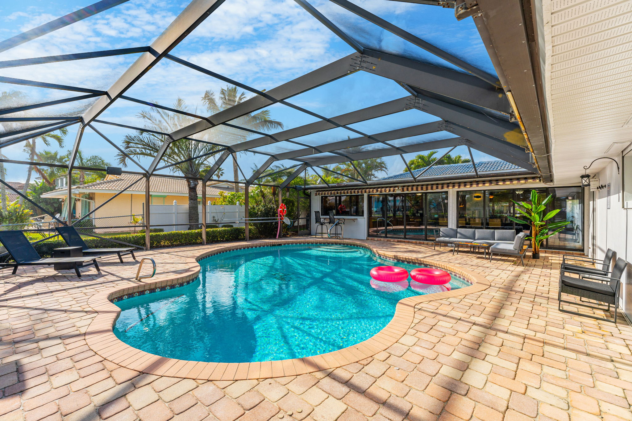 Relax and unwind in the private pool, surrounded by beautiful landscaping and open skies.