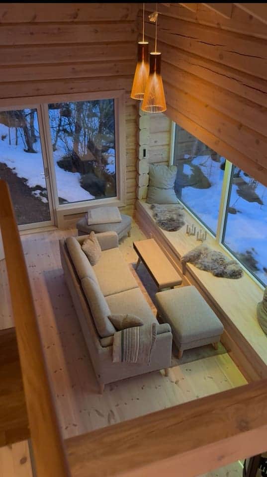Seating area with a view of the fjord and winter landscape – cozy & bright