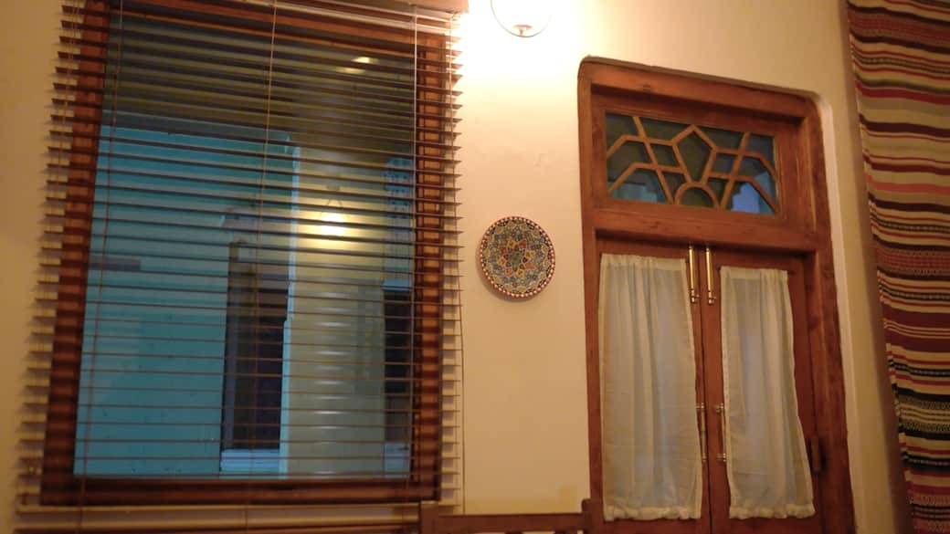 Soft light and heritage detail frame Saaya’s serene window