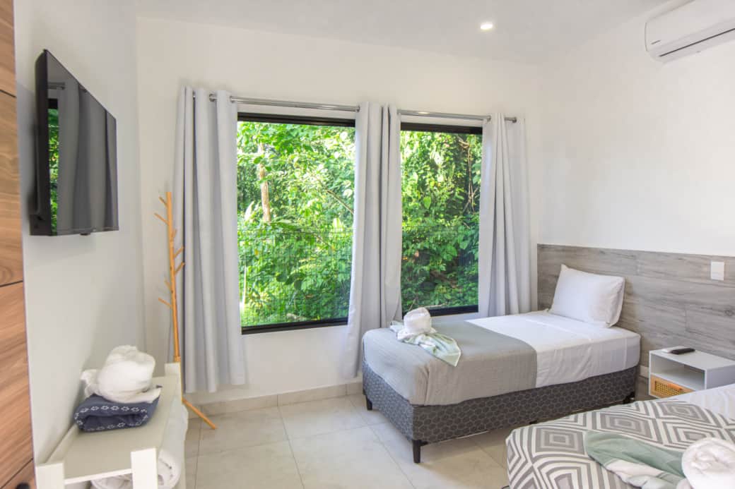 Villas somnara family room double single bed tv jungle view