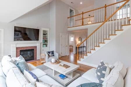 Family room with comfy furniture, gas fireplace, and smart TV