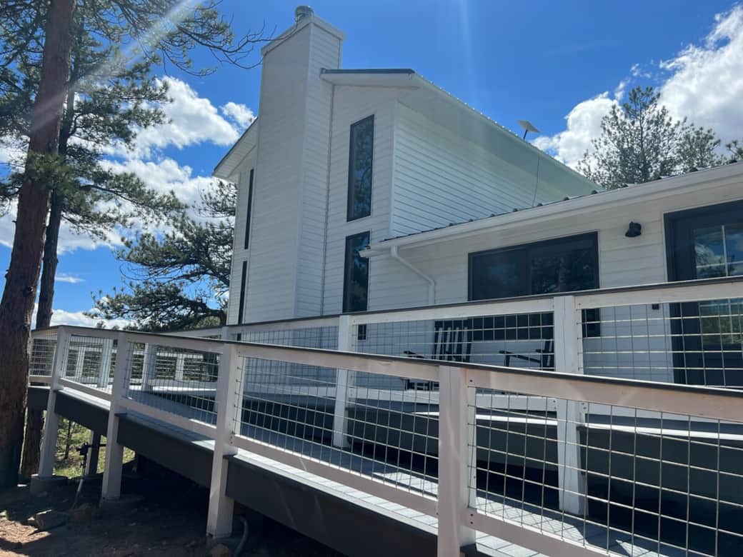 Exterior of the cabin with wrap around deck and wheelchair accessible ramp