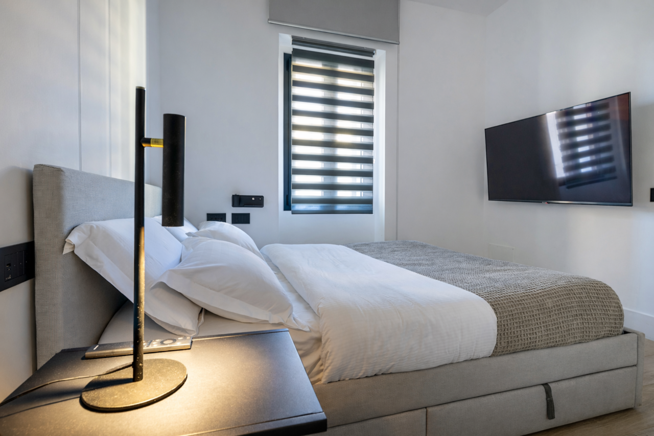 Via la marmora modern bedroom king bed window smart tv rental12
