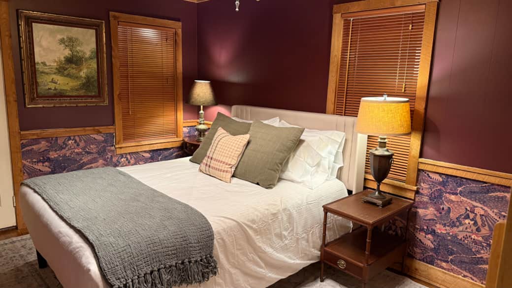 Family room features the original stenciled wood paneling from the 1920 addition. 