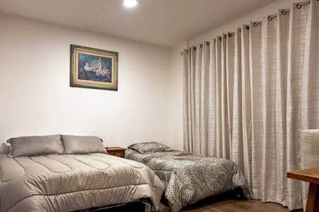 Room 2, 2 Beds: Spacious room with two cozy beds, perfect for families or friends traveling together
