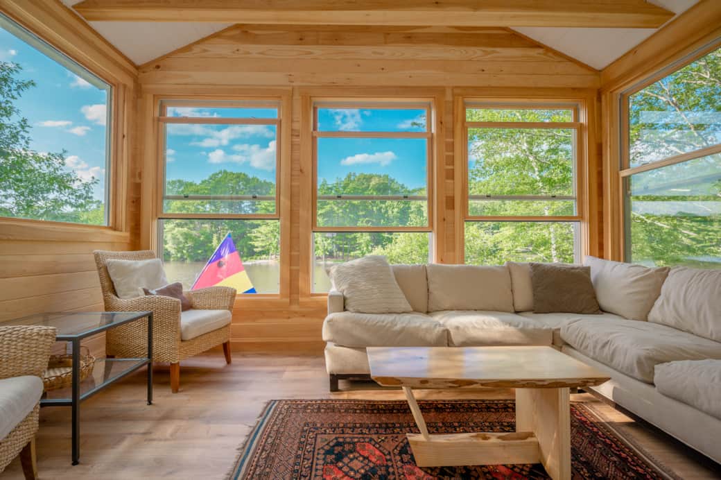 Living room sunroom with lake views.