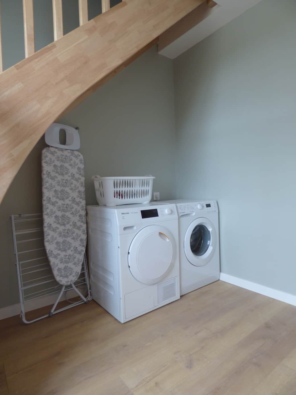 Washing machine, drier, ironing board and iron and clothes rack, conveniently located under the staircase on the ground floor. Washing machine, drier, ironing board and iron and clothes rack, conveniently located under the staircase on the ground floor.