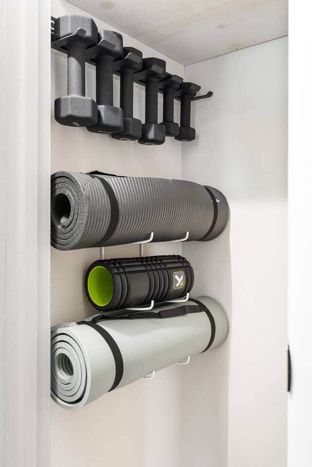 Workout equipment located in hallway by 3 main front bedrooms in the closet.