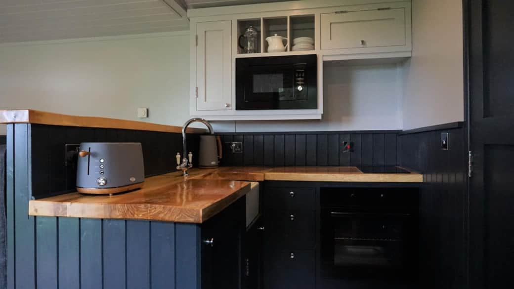 Stylish kitchen with wooden worktops & modern appliances