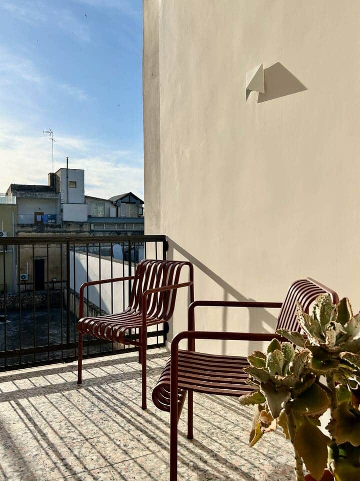 The bedroom has its own private balcony featuring local terrazzo tiles 
