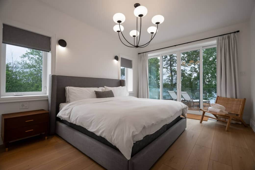 King sized bed on main level (2nd floor) with its own full bathroom and walk-out to deck.