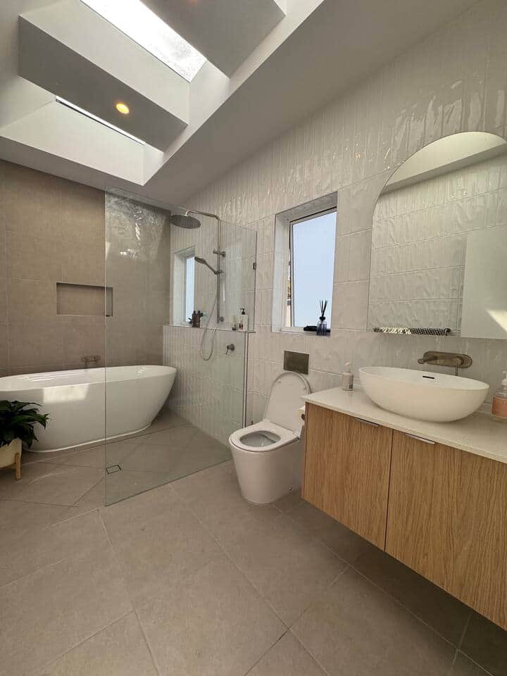 Master ensuite attached to master bedroom w/large bath, walk in shower w/rain head & handheld. 