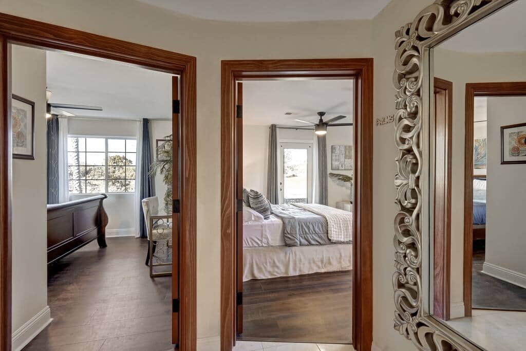 End of hall view of Azul and Palms bedrooms, both with Queen beds