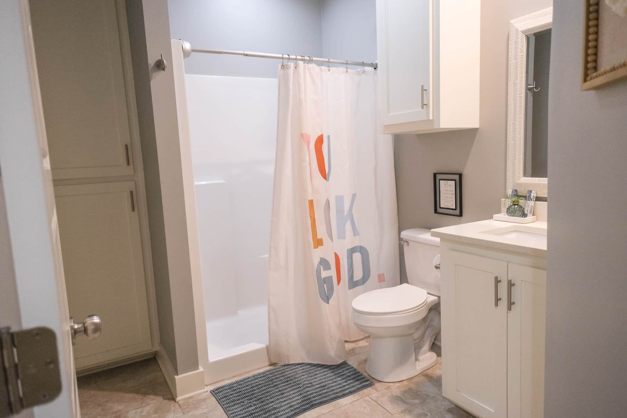 Guest bath with singe vanity and walk in shower.jpg