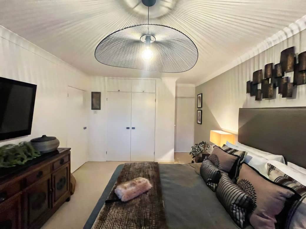 Comfort Meets Convenience: The master suite offers a spacious closet, in-room TV for relaxing entertainment, and a private en-suite bathroom, creating a perfect blend of luxury and functionality.