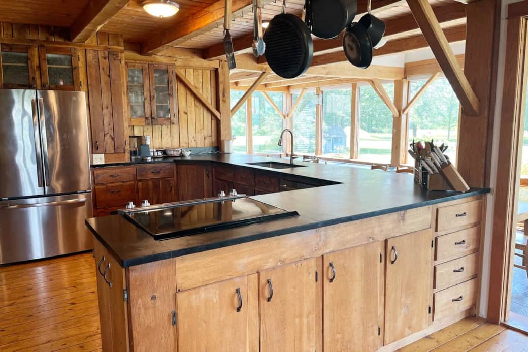 Vermont country kitchen, fully appointed, new appliances and Soapstone countertops, beautiful views, connected to great room and solarium