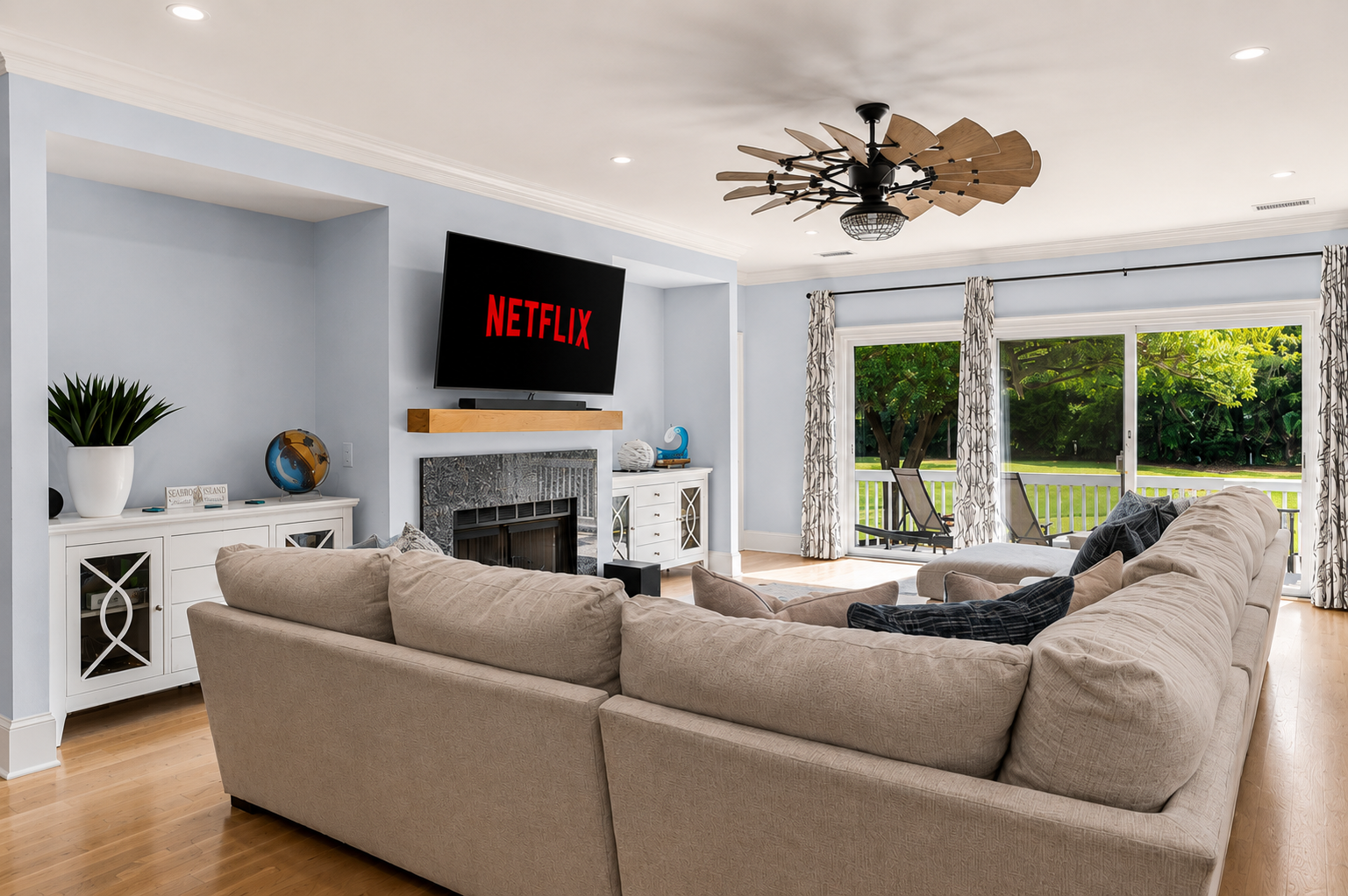 Stretch out on the sectional and catch the green backyard view through the doors.