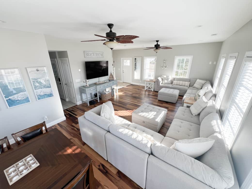 Spacious living room with 2 large sectionals and a table for additional dining space or games!