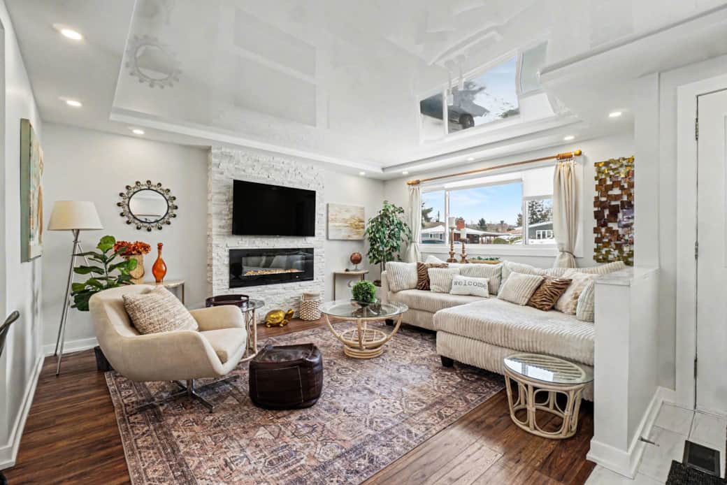 Bright stylish living room with comfy seating and smart TV for cozy nights