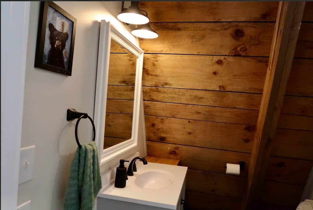Bathroom with shower and provided soaps (body wash, shampoo, conditioner)