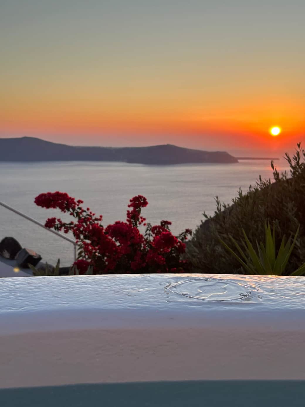Santorini sunset view while relaxing in your private jacuzzi.