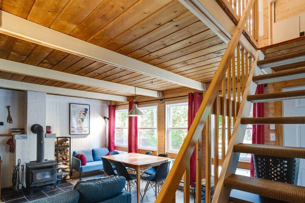 Living room with wood fireplace and dining table Living room with wood fireplace and dining table