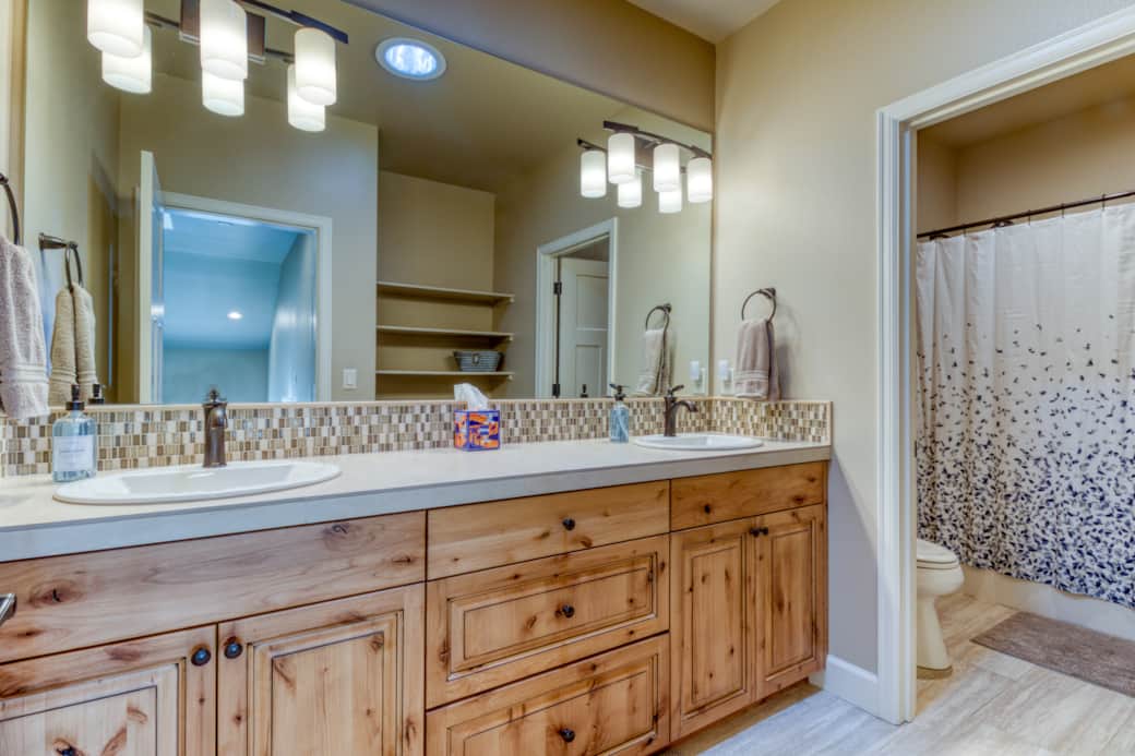 Upstairs full bath with dual sinks, Alder vanity, and tub/shower combo