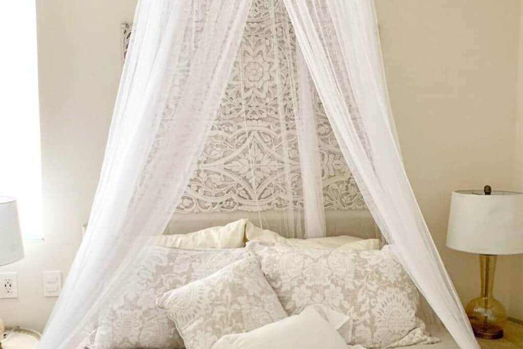 Experience pure bliss and uninterrupted comfort in a cozy bed adorned with soft, inviting pillows.